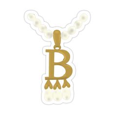 the letter b on a necklace with pearls hanging from it's back end, in gold