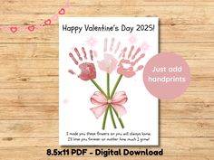 a valentine's day card with handprints and pink ribbon on the front