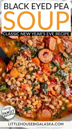 black eyed pea soup with sausage, beans and spinach in a white bowl on top of