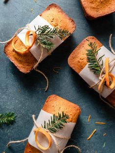 three pieces of bread wrapped in twine and decorated with orange slices