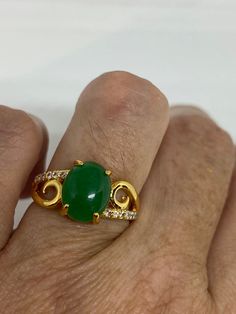 Vintage Lucky Green Nephrite Jade ring Fun jade is color enhanced Large green nephrite jade Ornate German Gold finished Vintage ring, does not tarnish, NOT sterling Size 6.5, 7 or 9 All rings are shipped free in the US in a nice gift box. Check out our over a THOUSAND great reviews Engraving is $4 per letter and is not always perfect depending on the piece. It can take a few days if the jeweler is busy. This is payable to Paypal Judithsltd@gmail.com Green Jade Spiritual Rings, Spiritual Jade Gemstone Rings, Spiritual Green Jade Rings, Quartz Choker, Pretty Accessories, Lucky Green, Nephrite Jade, Jade Ring, Vintage Ring