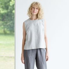 "Sprinkle some colour to your everyday look with the handmade 100% natural linen blouse that makes it an ideal piece for spring-summer. Looks fabulous when tucked into skirts with waistbands. Ideal for the stylish woman on-the-go. Neckline: round Sleeves: no Pockets: no Details: *Oeko-Tex Standard certified linen *Colour shown: grey ice blue (1st picture) *Model is wearing size M *Medium weight *Maternity friendly *Relaxed fit *Not-ironed (and no need to) *Handmade by @LinenCloud Easy care: - Ma Casual Flax Tops For Spring, Spring Linen Blouse In Flax Color, Casual Ramie Top For Spring, Spring Flax Ramie Blouse, Spring Flax-colored Ramie Blouse, Spring Flax Colored Ramie Blouse, Spring Linen Sleeveless Blouse, Spring Sleeveless Linen Blouse, Linen Summer Tops For Daywear