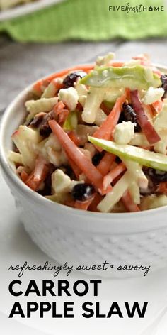 a white bowl filled with carrot apple slaw