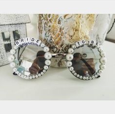 a pair of sunglasses with the words bride to be written on them