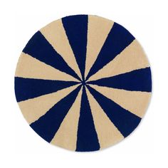 a blue and beige circular rug on a white background