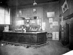 an old fashioned bar with lots of bottles on it