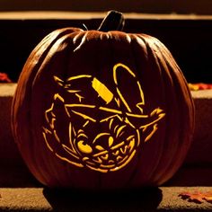 a carved pumpkin with an angry cat on it