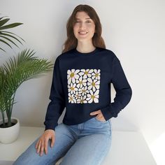 Everyone loves a comfy sweatshirt in the fall. Check out this adorable funky print and let that inner babbs turn outter ;) Check out the cute little flower on the left sleeve 🌼 .: 50% cotton, 50% polyester.: Medium-heavy fabric (8.0 oz/yd² (271.25 g/m²)).: Loose fit.: Sewn-in label.: Runs true to size Cozy Cotton Sweatshirt For Spring, Cute Graphic Print Sweater With Relaxed Fit, Fall Cotton Sweater With Floral Print, Fall Cotton Floral Print Sweater, Cotton Floral Print Sweater For Fall, Cotton Floral Print Fall Sweater, Cotton Floral Print Long Sleeve Sweater, Trendy Long Sleeve Sweatshirt With Funny Print, Casual Long Sleeve Sweatshirt With Funny Print