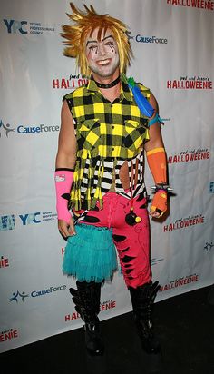 a man dressed up as a clown for halloween