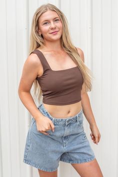 The perfect top to pair with any outfit- our new Move Along Crop Top! This new arrival can be worn all year round and styled in so many ways! Features a ribbed knit material, a square neckline, tank top straps, and a cropped length. Available in black, brown, and hunter green. polyester spandex turn inside out hand wash with cold water lay flat to dry low iron if needed Models are wearing a size small Trendy Ribbed Square Neck Tank Top, Ribbed Square Neck Trendy Tank Top, Solid Ribbed Tank Top With Square Neck, Solid Ribbed Square Neck Tank Top, Casual Ribbed Crop Top With Square Neck, Spring Ribbed Crop Top With Square Neck, Trendy Ribbed Crop Top With Square Neck, Trendy Seamless Square Neck Crop Top, Trendy Square Neck Tank Top For Spring