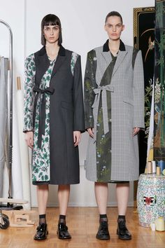 Tailored Avant-garde Spring Outerwear, Spring Avant-garde Blazer For Workwear, Avant-garde Spring Blazer For Work, Elegant Patchwork Outerwear For Spring, Avant-garde Long Coat For Spring, Avant-garde Long Coat For Workwear, Tailored Asymmetrical Spring Outerwear, Avant-garde Asymmetrical Outerwear For Work, American Fashion Designers