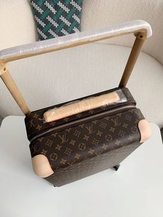 Travel with Timeless Elegance: Horizon 55-Inspired Suitcase in Brown Monogram Canvas Embark on your journeys with this Horizon 55-inspired suitcase, a tribute to Louis Vuitton's legacy of craftsmanship and innovation. The iconic monogram canvas, rendered in a timeless brown colorway, exudes sophistication and prestige. Designed for effortless travel, this suitcase boasts smooth-rolling wheels and a lightweight construction. The spacious interior offers ample room for your belongings, while the d Fall Winter Jacket, Lv Monogram, Loafer Sneakers, Bottega Veneta Shoulder Bag, The Prestige, Monogram Canvas, Loafer Shoes, Louis Vuitton Monogram, Sneaker Boots