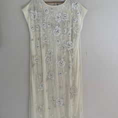 Zara Limited Edition Ivory Colored Beaded Midi Dress Is New With Tags! This Is Such A Splendid Dress For Summer/Spring - Even A Wedding Or Wedding Dress- From Zara's Limited Edition Line. Sold Out On The Zara Site. Ivory Colored Background With Incredible Beading And Sequins; Beads Are White And Cream With Faux Diamond Accents. Exquisite! One Button Closure In Back. Netted Front With Attached Camisole Within. Really Makes The Most Lovely Statement. Medium: 48 Inches From Nape Of Neck To Bottom H Summer Evening Dress With Pearl Embroidery, Festive White Floral Dress, Off White Embellished Party Dress, Elegant White Embellished Maxi Dress, White Pearl Embroidered Cocktail Dress, Elegant Cream Maxi Dress With Floral Embroidery, Cream Floral Embellished Summer Dress, Embellished White Floor-length Maxi Dress, Sequined White Maxi Evening Dress