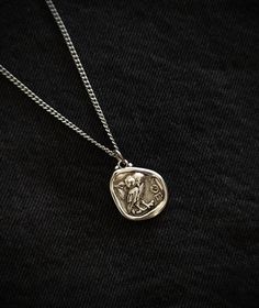 This necklace is composed of an ancient greek spinner coin pendant in silver filled brass, a  durable and fashionable piece that compliments any outfit. Perfect gift for him! The pendant is also double sided as seen in the pictures. About the coin: The owl represents prosperity and pride of Ancient Greece. It also is the emblem of the city of Athens. Above all, it was the first widely recognized international coin in classical antiquity. This historical coin depicts the helmeted head of Athena o Necklaces For Him, Owl Of Athena, Historical Coins, Greek Mythology Jewelry, Pendant Necklace Men, Mythology Jewelry, Silver Coin Necklace, Classical Antiquity, Perfect Gift For Him