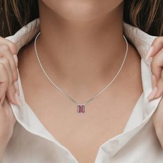 Fancy Pink Emerald Solitaire Diamond Necklace made with an fancy Pink emerald cut diamond in bezel setting with adjustable chain. ✦ 𝐒𝐭�𝐨𝐧𝐞 𝐃𝐞𝐭𝐚𝐢𝐥𝐬✧ Shape: Emerald✧ Focal Stone Size: 1.00 CT, 1.50 CT, 2.00 CT, 2.50 CT, 3.00 CT✧ No of Diamonds: 1✧ Stone Type: Lab Grown Diamond ✧ Diamond Clarity: VS1+✧ Diamond Color: Fancy Pink ★ 𝐍𝐞𝐜𝐤𝐥𝐚𝐜𝐞 𝐃𝐞𝐭𝐚𝐢𝐥𝐬: ✧ Metal Type: Solid Gold ✧ Metal Purity: 14K Solid Gold, 18K Solid Gold ✧ Metal Tone: Yellow Gold, White Gold, Rose Gold✧ Setti Pink Emerald, Diamond Solitaire Necklace, Halo Earrings Studs, Halo Earrings, Vs Diamond, Solitaire Necklaces, Diamond Charm, Fancy Color Diamonds, Emerald Cut Diamonds