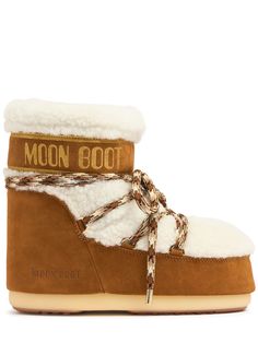 Shearling and suede upper. Drawstring closure at collar. Front lace-up closure. Logo detail. Rubber sole. SIZING: ,35 = 35/36,37 = 37/38,39 = 39/40,41 = 41/42 Apollo 11 Moon Landing, Apres Ski Style, Embossed Text, Ski Style, Moon Boot, Ski Fashion, Moon Landing, Ski Accessories, Oversized Jumper