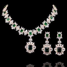 For edgy style and sophisticated sparkle, this necklace set is a dream come true! Elegant and shimmering set with CZ and emerald stones creating a flawlessly fresh finish for each and every one of your evening ensembles. The set includes a necklace, and a pair of beautiful earrings. Approximate earrings length is 2.1". Designed over a high-quality brass as base metal. Available in 3 plating options. Almina Set (Gold) is in-stock & ready-to-ship. Delivery time frame for Almina Set (Rose Gold) & ( Green Crystal Jewelry Sets With Sparkling Stones, Green Sparkling Stones Jewelry Sets For Party, Hand Set Emerald Necklace With Cubic Zirconia For Party, Hand Set Cubic Zirconia Emerald Necklace For Party, Hand-set Cubic Zirconia Emerald Necklace For Party, Evening Green Jewelry With Diamond Accents, Party Crystal Emerald Necklace Hand Set, Green Jewelry Sets With Diamond Accents For Party, Glamorous Green Jewelry