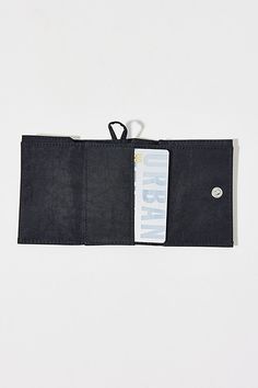 BAGGU snap wallet. This handy trifold wallet from BAGGU features a webbing loop so you can clip it to your keychain, with four card pockets, one bill fold and a snap closure. Made of recycled heavyweight nylon body with recycled ripstop nylon exterior. Features BAGGU nylon wallet Tri-fold design Made with recycled materials Hook & loop closure Content + Care 100% Recycled nylon Machine wash Imported Size Dimensions: 4" l x 3" h | BAGGU Snap Wallet in Black, Women's at Urban Outfitters Everyday Rectangular Trifold Wallet With Snap Closure, Black Wallet With Snap Closure, Black Trifold Wallet With Snap Closure, Black Rectangular Trifold Wallet With Snap Closure, Functional Trifold Wallet With Interior Card Slots, Everyday Trifold Wallet With Snap Closure, Functional Black Trifold Wallet For Everyday Use, Functional Trifold Wallet For Everyday Use, Functional Foldable Wallets For Everyday Use