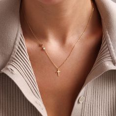 Celebrate faith and elegance with our Sideways Cross Necklace. This dainty gold cross necklace is the perfect blend of simplicity and sophistication, making it an ideal gift for her. The tiny cross necklace design is subtle yet meaningful, suitable for everyday wear or special occasions. Perfect for a confirmation gift or baptism gift, this minimalist necklace is crafted to highlight its delicate charm while showcasing a symbol of faith. Made with high-quality materials, it offers a timeless app Minimalist 14k Gold Cross Necklace As Gift, Cross Necklace Stack, Gold Cross Necklace With Delicate Chain As Gift, Gold Minimalist Personalized Cross Necklace, Minimalist Yellow Gold Cross Necklace Gift, Dainty Cross Necklace For Baptism, Dainty Cross Necklace, Tiny Cross Necklace, Cross Necklace Sideways