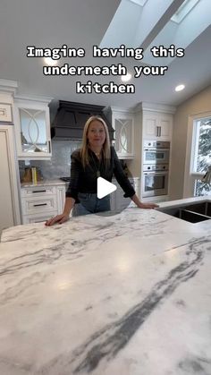 a woman standing in front of a kitchen counter top with the caption imagine having this underneath your kitchen