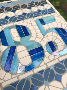 a close up of a table with blue and white tiles on it