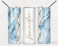 two blue and gold can coolers with the words be brave written on them in gold lettering