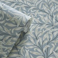 an image of a wallpaper with white leaves on blue and grey background for walls