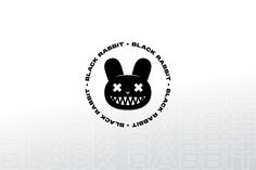 a black rabbit logo with teeth and fangs