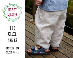 a person standing on a wooden deck wearing sandals with the words dizzy mister written above them