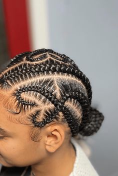 This fun cornrow style has rows that are braided in a complex way and curve around the head nicely, coming together into tidy ponytails. The smoothness of the cornrows goes well with the wound-up ends, adding a playful twist that's just right for active kids. The neat and protective nature of the hairstyle makes it a nice and useful choice for both - Click to see more of 20 Cute Cornrow Styles for Children and follow us for more hairstyle ideas. // Photo Credit: Instagram @pinahairstylist Colored Cornrows, Styles For Children, Cornrow Styles, Active Kids