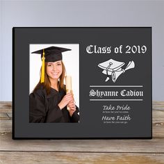 a black frame with a graduate's cap and tassel on it that says class of 2019