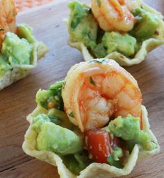 shrimp and guacamole cups on a cutting board