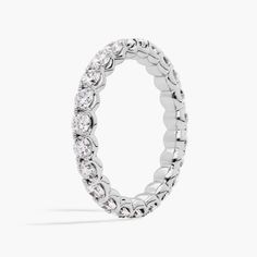 a white gold ring with round diamonds