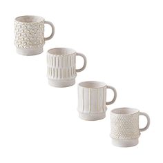 three white coffee mugs sitting next to each other on a white surface with wavy lines