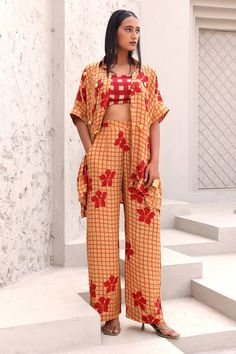 Orange, red shirt with checkered, floral hand block print and gold embellishment. Paired with bustier and pant. - Aza Fashions Red Cotton Designer Wear Sets, Red Cotton Sets For Designer Wear, Fitted Pant Set With Printed Motifs For Summer, Summer Fitted Pant Set With Printed Motifs, Fitted Summer Pant Set With Printed Motifs, Summer Straight Pants Set With Printed Motifs, Red Printed Motifs Summer Sets, Summer Red Printed Motifs Set, Summer Sets With Printed Motifs And Straight Pants