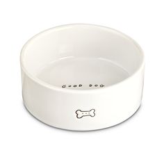 a white dog bowl with a bone on the side