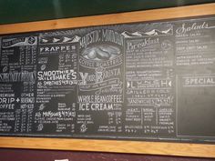 a chalkboard menu on the wall of a restaurant