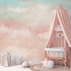 a baby's room decorated in pink and white with a canopy bed, crib, stars and clouds on the wall