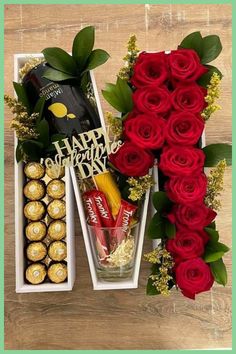 roses, chocolates and flowers are arranged on a table