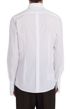 From the label's 'Re-Edition' collection comes this cotton-poplin shirt that features a partially hidden placket and a tuxedo-style bib. 31" length; 38" chest (size Medium) Front button closure Point collar Long sleeves with two-button cuffs 100% cotton Dry clean Made in Italy Men's Designer Clothing Designer Fitted White Dress Shirt, Luxury Formal Cotton Shirt, Luxury Cotton Formal Shirt, Designer Fitted Tops For Business, Luxury Fitted Shirt For Daywear, Formal White Poplin Tops, Luxury Fitted Daywear Shirt, White Poplin Tops For Formal Occasions, Designer Fitted Shirt With Concealed Placket