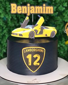 a birthday cake with a yellow car on top