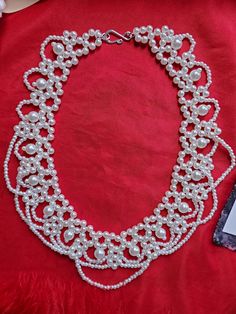 This listing is for a lovely vintage style one-strand festoon glass pearl necklace.  It measures 16 inches long.  I can add a chain to it that will allow you to extend it longer to make it more adjustable.  Just mention that at checkout. Perfect for your everyday or historical/costuming needs.  This necklace spans the test of time, and can be worn for multiple centuries as well as today.  These are hard to find.  I changed the clasp to a silver hook and ring to make it more period appropriate. Y Vintage White Beaded Necklaces With Pearl Drop, Vintage Pearl White Round Bead Necklaces, Vintage Pearl Drop Necklaces With Round Beads, Vintage White Beaded Necklace With Pearl Drop, Vintage Pearl White Necklaces With Round Beads, Vintage Pearl Beaded Bridal Necklace, Vintage Pearl Necklace With Round Beads For Weddings, Handmade Vintage Pearl Necklace For Formal Occasions, Vintage Handmade Pearl Necklace For Formal Occasions