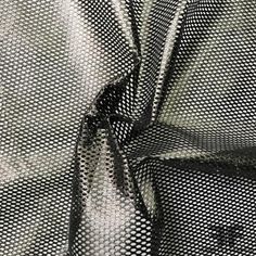 Black Laminated Fishnet Mesh One-way stretch Reflective surface Content - Vinyl/Nylon Color - Black Width - 62" Fabric Care - Dry Clean Only Embroidered Leaves, Fashion District, Reflective Surfaces, Nyc Fashion, Silk Organza, Soft Sculpture, Floral Chiffon, Fashion Fabric, Fabric Store