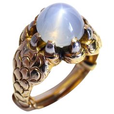 A very unusual unisex yellow gold ring, designed around a natural star sapphire (ca. 6 ct), which is being clawed by the gold ring. Ring size: 8 (with clamp, so can fit smaller fingers as well). Power Elements, Dome Rings, Yellow Gold Sapphire Ring, Goth Ring, Sapphire Cocktail Ring, Star Sapphire Ring, Gold Sapphire Ring, Claw Ring, David Webb