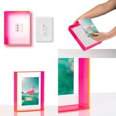 a person is holding an item in front of three different colored frames on the wall