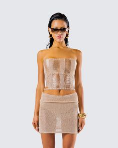 You’re golden 😌 This stunning gold knit tube top, crafted from fully fashioned knit fabric, features a chic vertical drop stitch that adds an extra touch of elegance and flair - perfect for stealing the spotlight ⭐ Glamorous Bandeau Stretch Tops, Strapless Gold Tube Top For Summer, Sleeveless Knit Crop Top For Party, Trendy Knit Top For Parties, Elegant Gold Crop Top For Night Out, Chic Beige Tube Top For Night Out, Gold Strapless Top For Party, Knit Top For Summer Party, Fitted Gold Strapless Tube Top