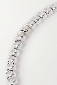 Bottega Veneta's necklace is strung from teardrop-shaped chain links that perfectly fit into one another. It's made from silver for a short drop that falls to the collar bone. Wear it solo or stacked with more delicate styles. Silver Teardrop Single Strand Jewelry, Classic Silver Long Drop Necklace, Silver Single Strand Teardrop Necklace, Elegant Teardrop Necklace With Sterling Silver Clasp, Silver Teardrop Single Strand Necklace, Silver Drop Necklace With Chain Detail, Silver Drop Chain Necklace, Silver Teardrop Necklace With Lobster Clasp, Silver Teardrop Chain Necklace