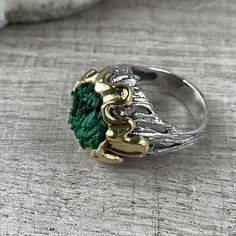 Natural malachite ring in sterling silver and gold. It is gold plated around the stone. This ring is the perfect gift for unique and modern girls and women. All our jewelry is made of high-quality sterling silver and is stamped with a 925 stamp 【FULL DETAILS】 Gemstone: Natural raw malachite SIZE: any size available (choose from the option) WEIGHT: approx. 15 gr (0.03pounds) Stone Diameters: 16 mm (0.62 inches) The height from the finger: 12 mm (0.47 inches) ⦿ Attention: The color of the stones m May Birthstone Ring With Polished Finish, Handmade Emerald Crystal Promise Ring, Polished Open Emerald Ring For Gift, Polished Open Emerald Ring As A Gift, Polished Open Emerald Ring, Gift Polished Finish Open Emerald Ring, Gold Emerald Ring With Natural Stones For Anniversary, Unique Hallmarked Emerald Promise Ring, Silver Malachite Gemstone Ring