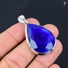 Welcome to StunningJewelryArts Blue Sapphire Gemstone Handmade 925 Sterling Silver Pendent  925 Stamped Gemstone Blue Sapphire gemstone Pendent For Gift *The most unique jewelry you can find, a perfect gift for you and your loved one PRODUCT INFORMATION * Gemstone : blue sapphire * Stone Shape : Same As Picture * Stone Category : Cabochon * Stone Polish : High * Metal : 925 Sterling Silver * Purity : 925 Parts Per 1000 * Silver Polish : High * Benefits Of Wearing Silver As a metal, silver has si Sapphire Lapis Lazuli Jewelry With Faceted Details, Blue Tanzanite Pendant Jewelry, Sterling Silver Jewelry With Natural Sapphire Stones, Blue Tanzanite Teardrop Jewelry, Sapphire Drop Gemstone Jewelry, Silver Sapphire Jewelry With Natural Stones, Blue Teardrop Pendant Jewelry With Large Stone, Sapphire Gemstone Jewelry In Lapis Lazuli, Sapphire Lapis Lazuli Gemstone Jewelry