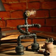 Cyberpunk Iron Pipe Robot Nightstand Lamp - Single-Bulb Brass/Copper Light For Boys Room Brass / A Industrial Pipe Table, Lampe Steampunk, Industrial Pipe Lamp, Industrial Lighting Design, Robot Lamp, Retro Table Lamps, Vintage Edison Bulbs, Style Steampunk, Pipe Lamp